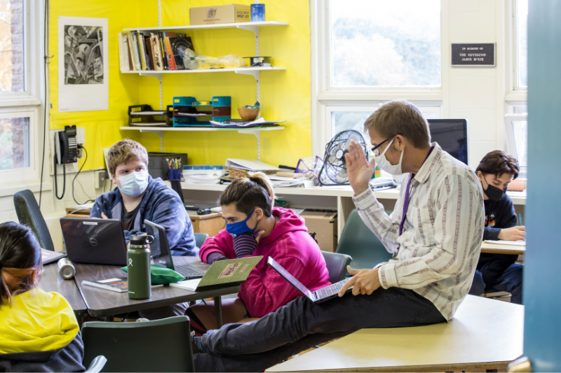 Math teacher engages students in a classroom 