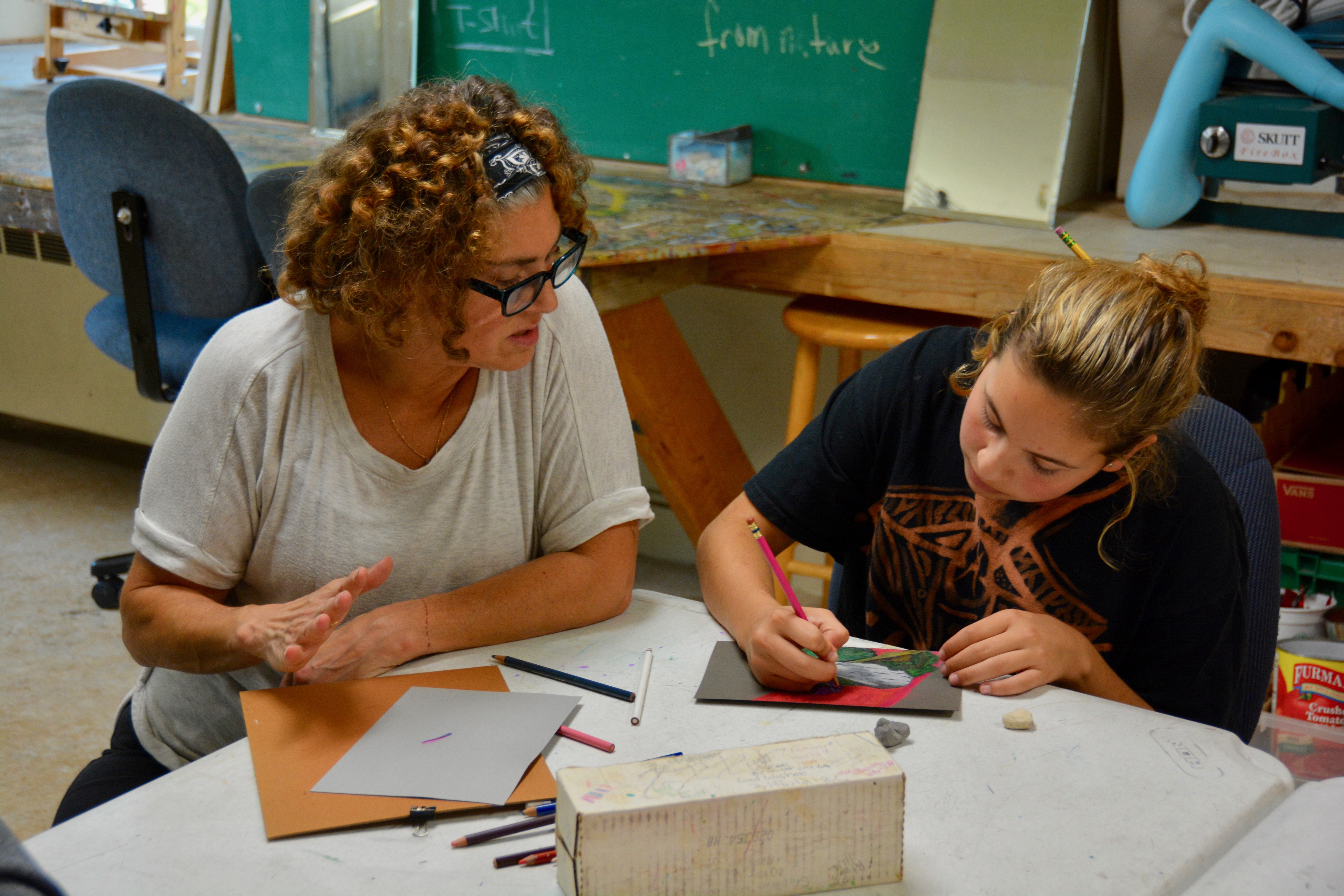 Student works on art piece