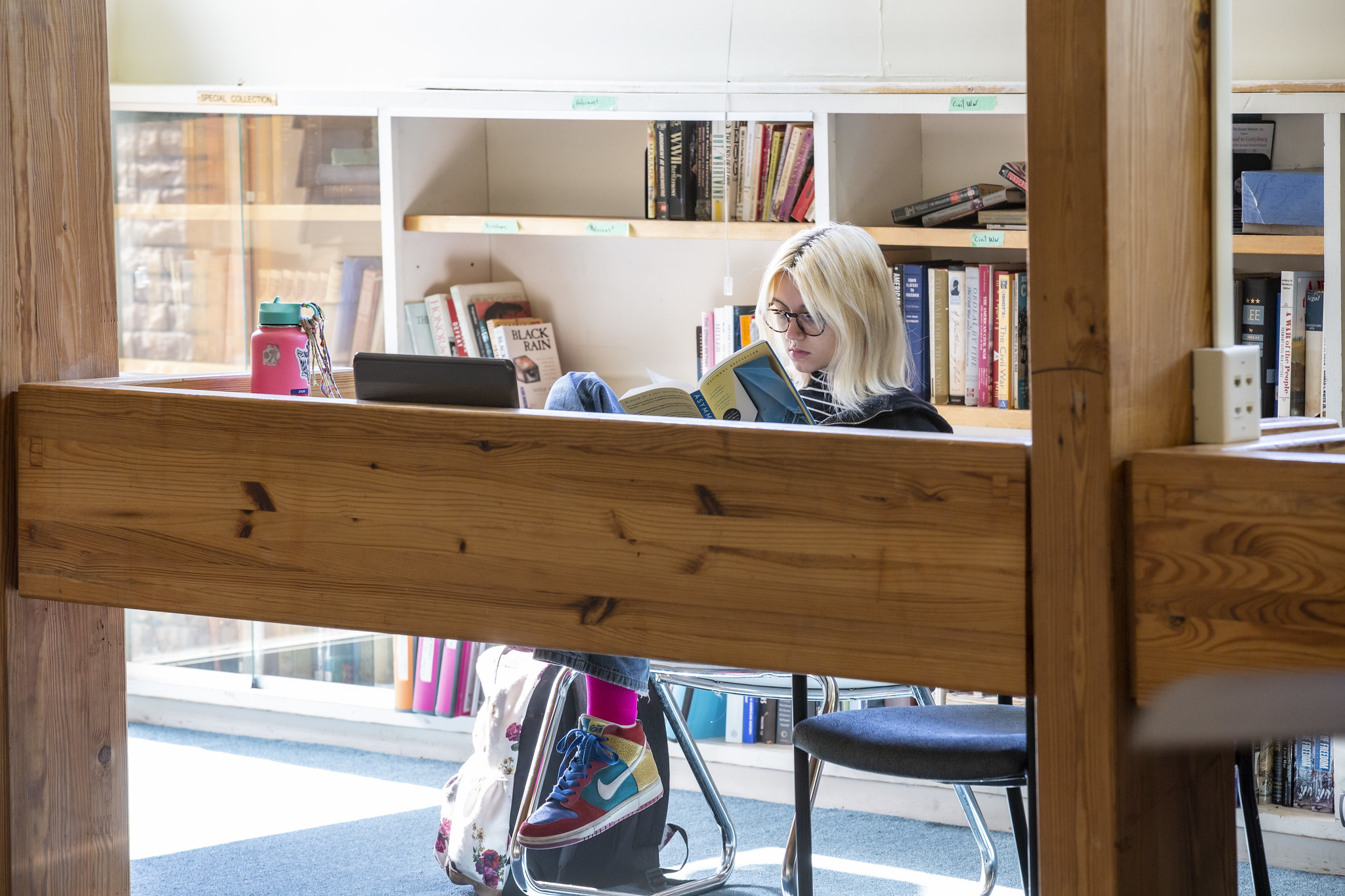 Student reading in the library