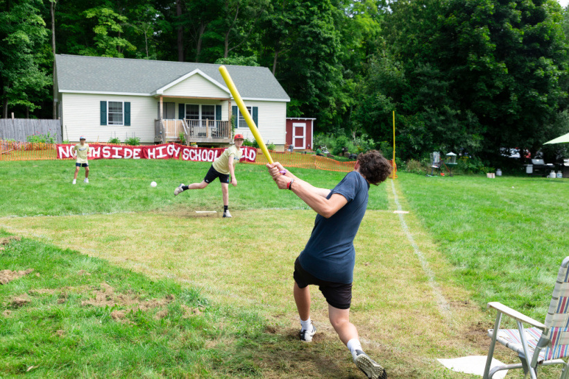 A pitcher and batter face off on a Wiffle ball field at Wiffle Fest 2023