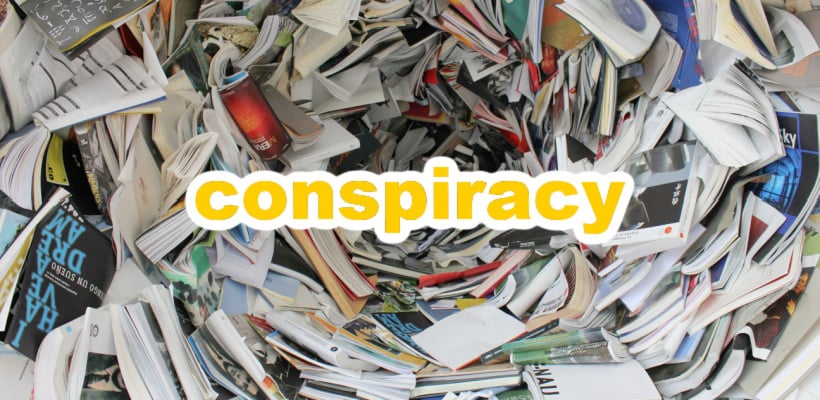 a tunnel made of books and magazines with "conspiracy" written in the middle